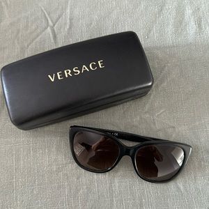 Versace sunglasses. I have had them for years and they are in great condition!